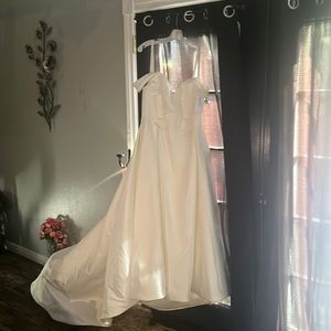 Brand new wedding dress tags still on